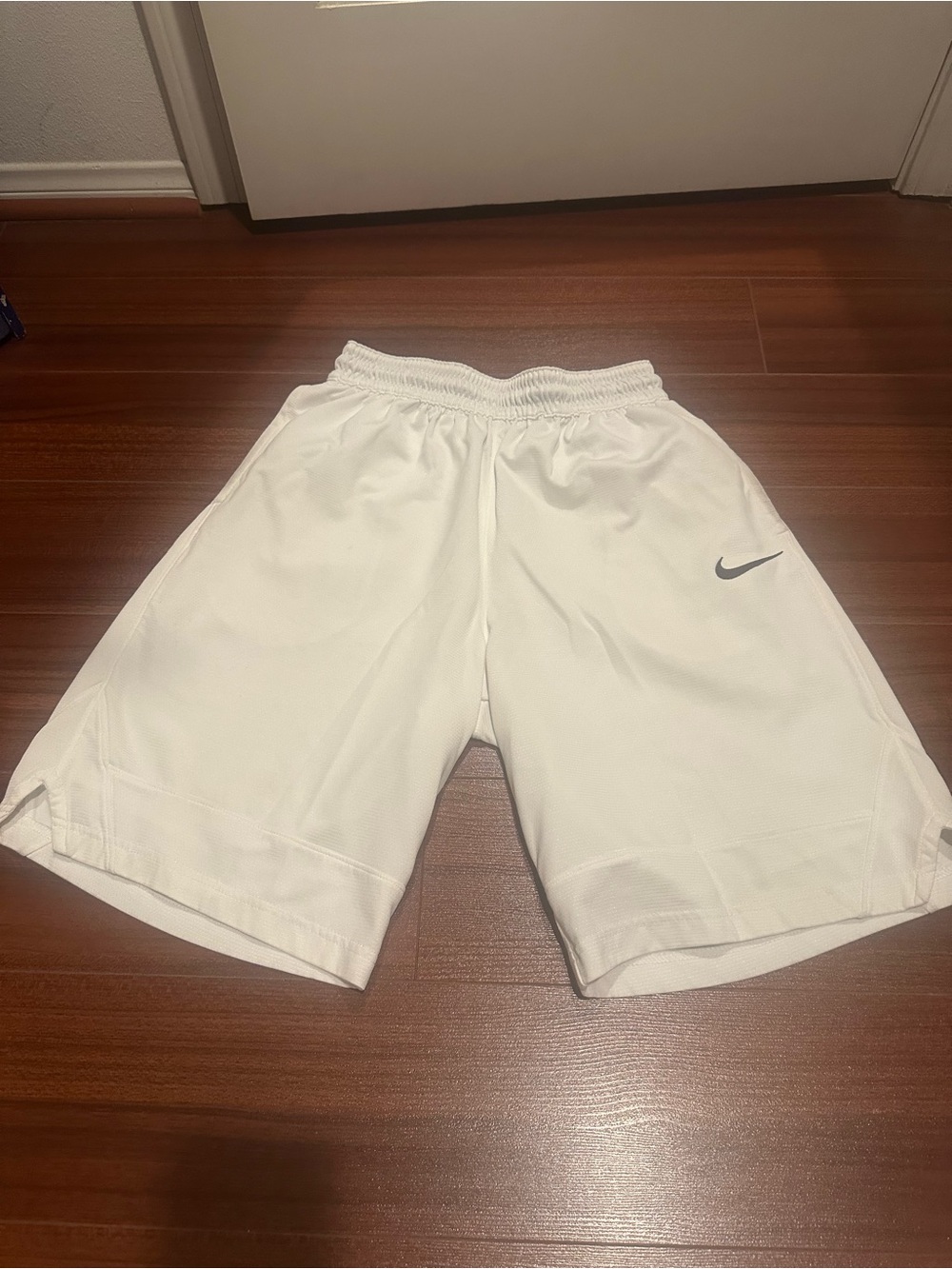 Nike Men's White Athletic Shorts with Black Swoosh